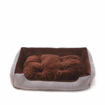 Oval cloth pet bed for dogs or cats in a striped colour pattern, showing its soft cushion shape.