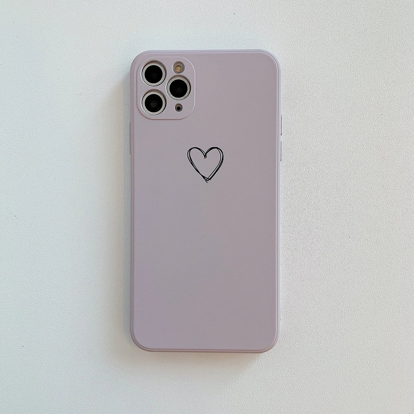 Silicone iPhone case in solid colours like black, green, pink, and white, showing TPU material and slim back cover design