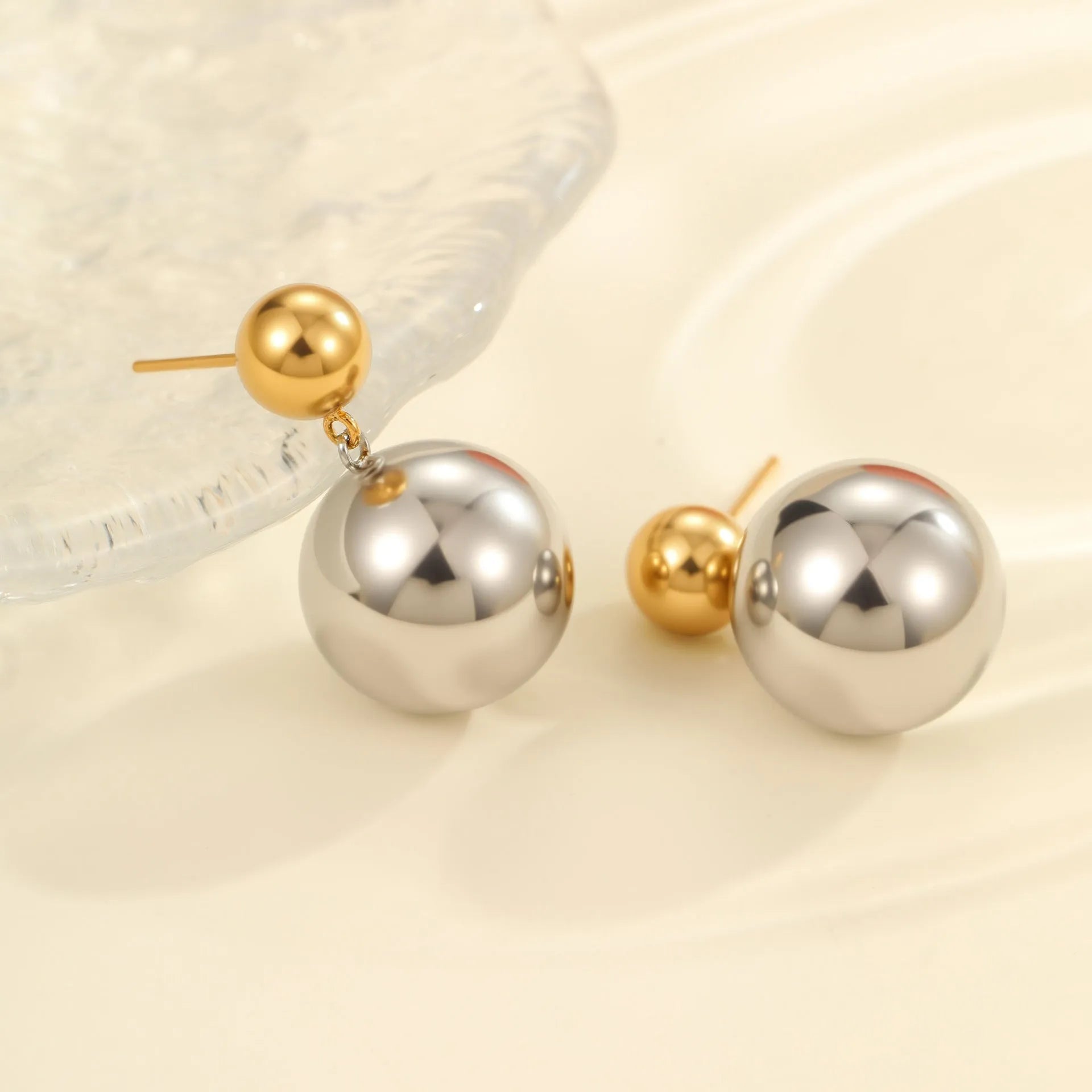 Geometric stainless steel ear studs with colour-block design and round bead elements