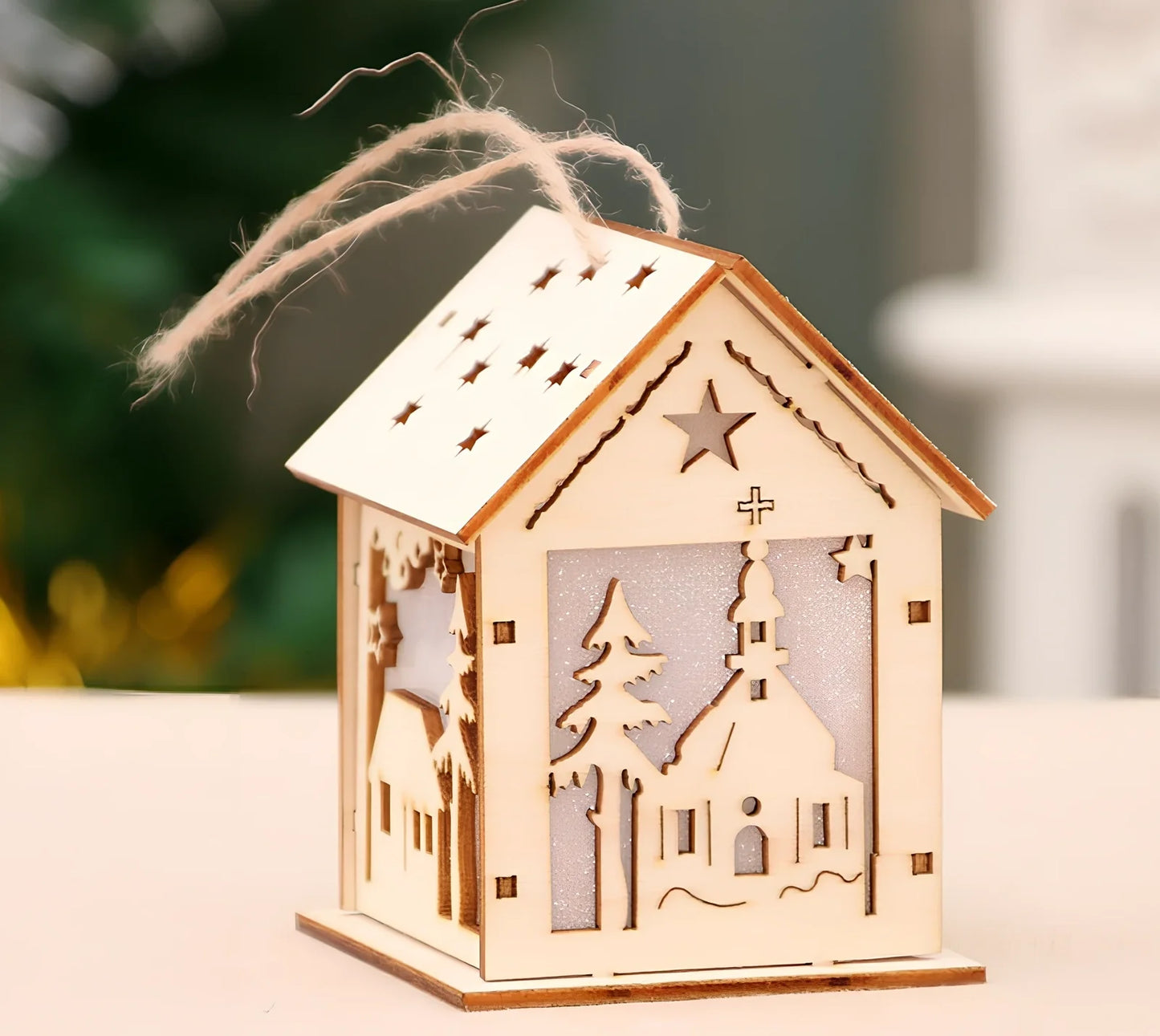 Wooden Christmas decorations with LED lights showing four character styles hanging on tree branches