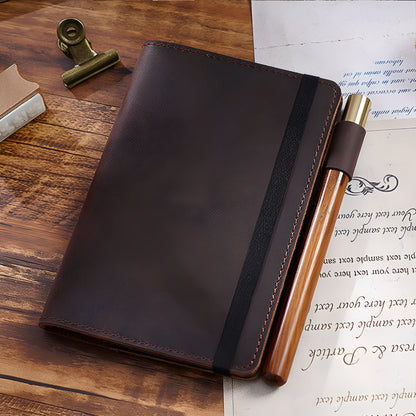 Handmade cowhide kraft notebook open showing wood-free paper, in dark green colour