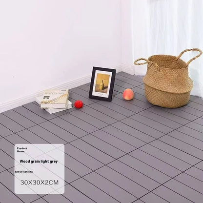 Plastic floor tiles with wood grain pattern showing 300x300mm dimensions and 23mm thickness profile