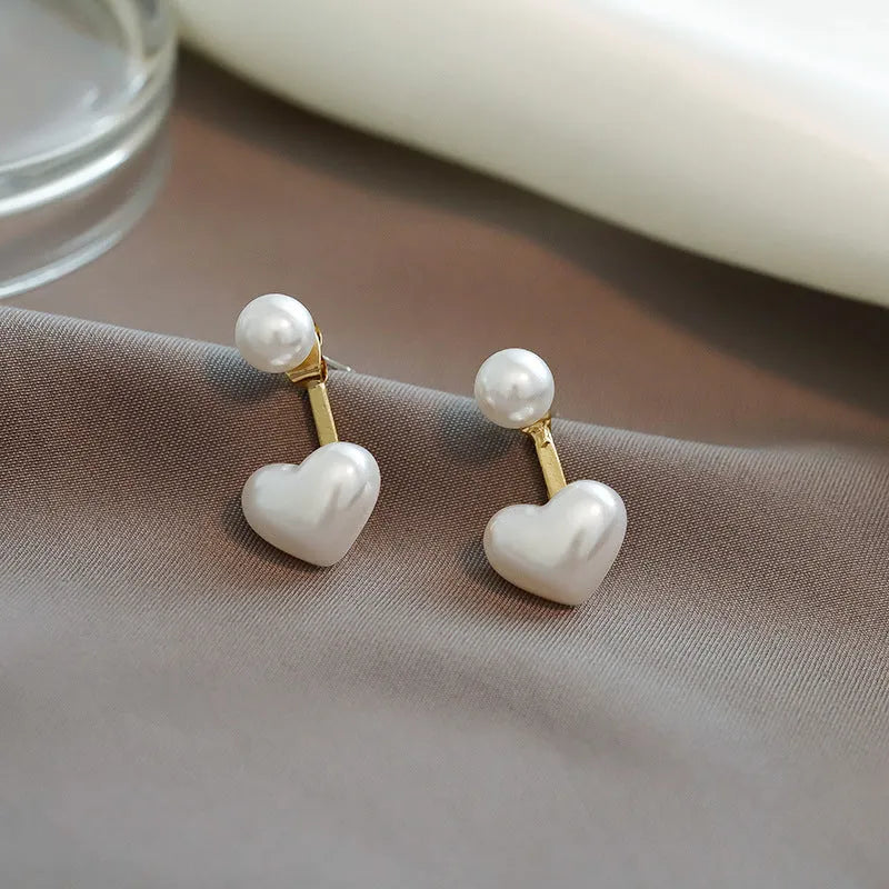 A pair of Korean style heart-shaped stud earrings in alloy with electroplated finish and inlaid artificial gems.