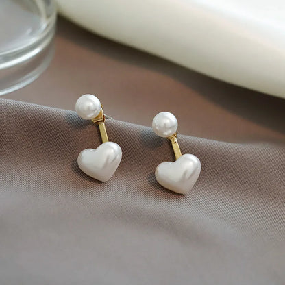 A pair of Korean style heart-shaped stud earrings in alloy with electroplated finish and inlaid artificial gems.