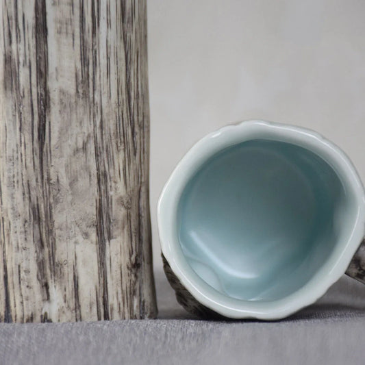 Irregular shaped bark-textured ceramic mug with 300ml capacity for hot drinks