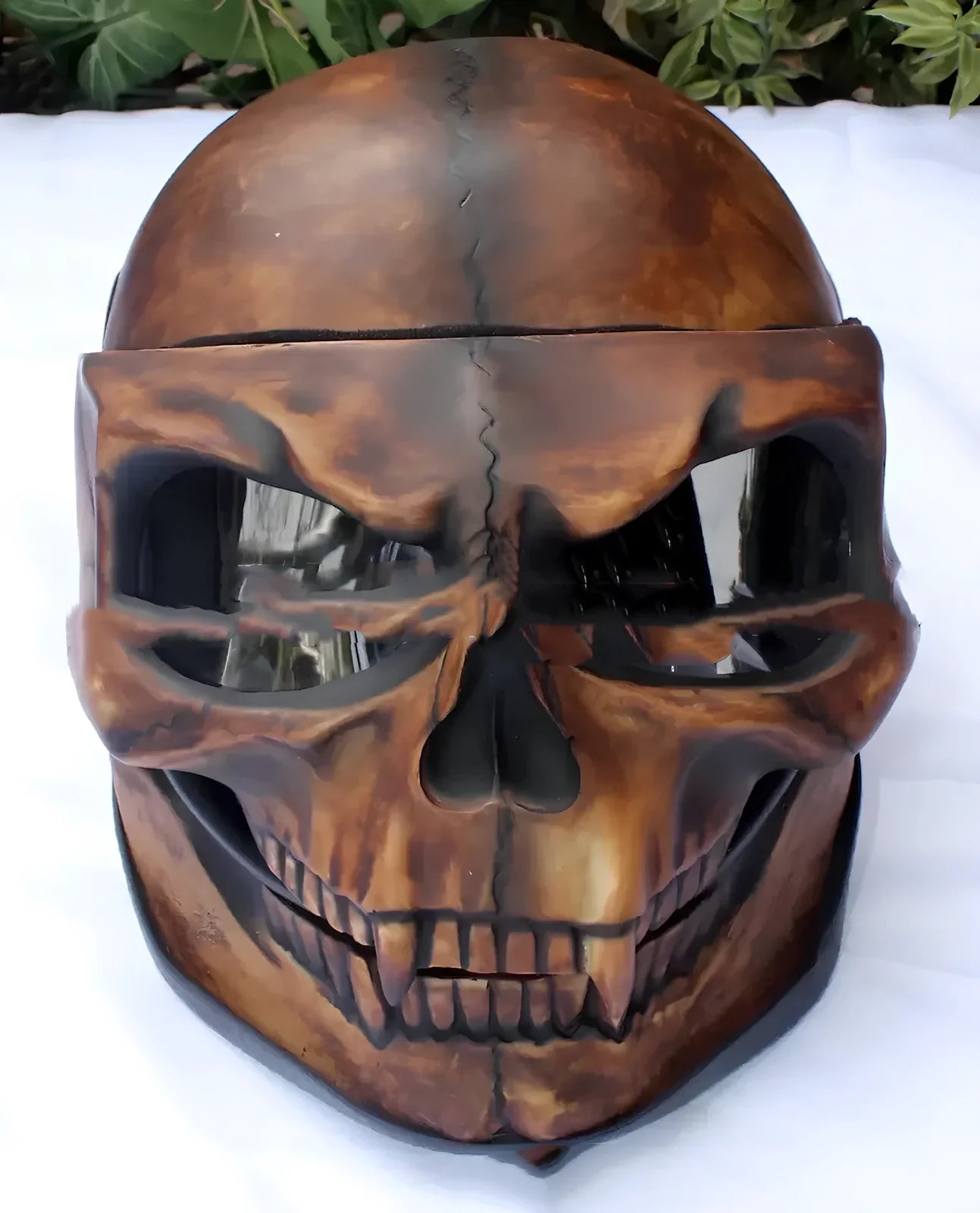 Latex Halloween skull head helmet mask in copper colour showing detailed facial features