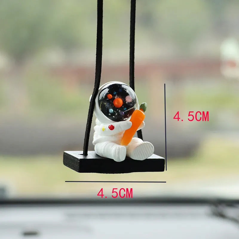 Colourful resin astronaut car pendant ornament with cartoon spaceman design on car dashboard