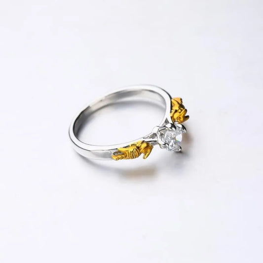 Copper ring with crown design in black gold colour on finger, showing detailed modelling