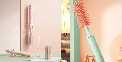 Electric baby bottle cleaning brush with rotating silicone head in pink or green colours