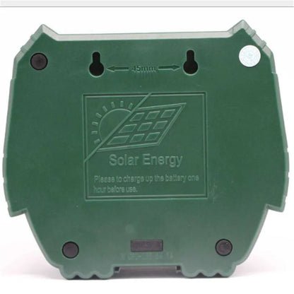 Green solar-powered ultrasonic dog and pest repeller unit for outdoor garden protection