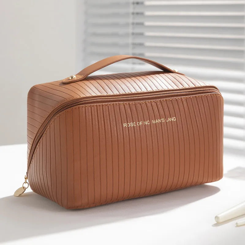 Vertical pattern pillow makeup bag for women with 22.5cm length, 12.5cm width and height, made from PU material for travel storage of underwear, cosmetics and toiletries