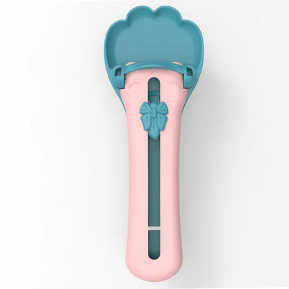 Green and pink pet food scoop and squeezer dispenser for cats and dogs.