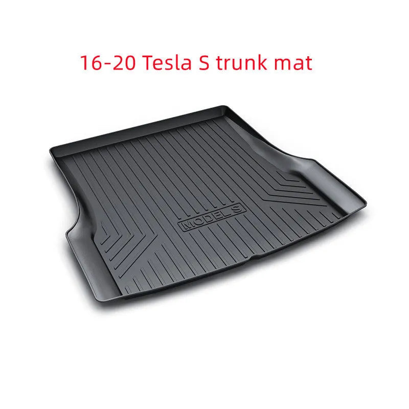 Black TPE rubber floor mats for Tesla Model 3, showing deep grooves and raised edges on driver's side.