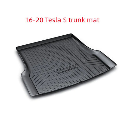 Black TPE rubber floor mats for Tesla Model 3, showing deep grooves and raised edges on driver's side.