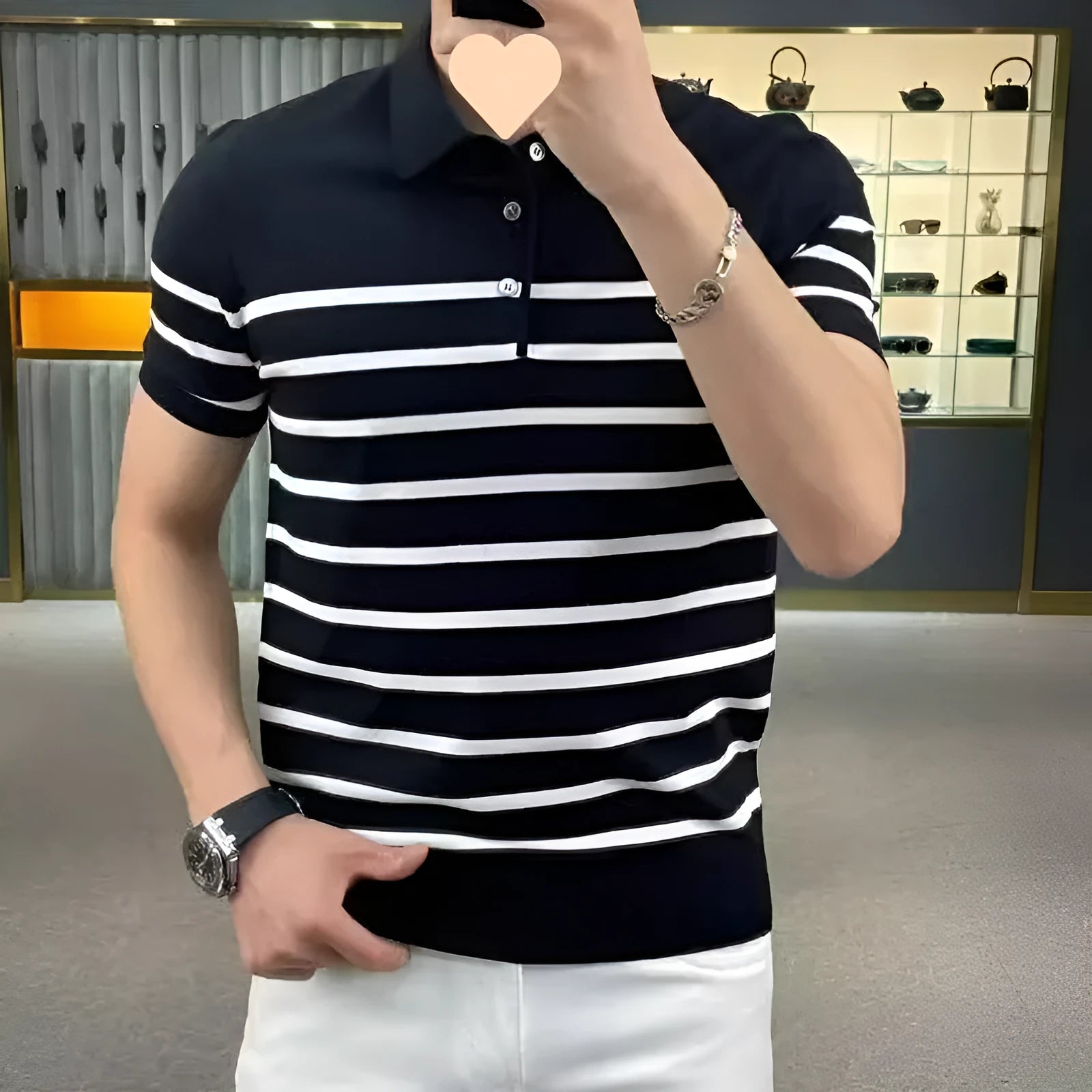 Black and white striped knitted t-shirt with lapel collar detail showing non-iron chemical fibre fabric