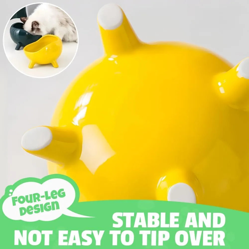 Green ceramic cat food bowl with four legs and elevated design for stable feeding