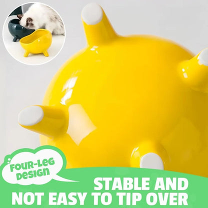 Green ceramic cat food bowl with four legs and elevated design for stable feeding