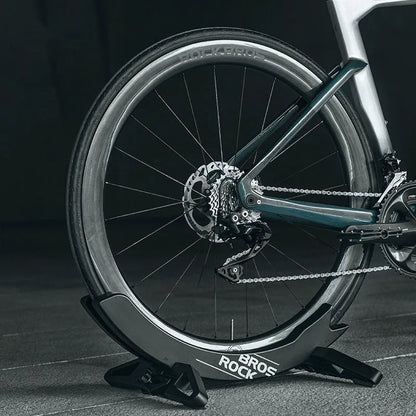 Black ABS plastic wall-mounted bicycle parking rack holder for road and mountain bikes.