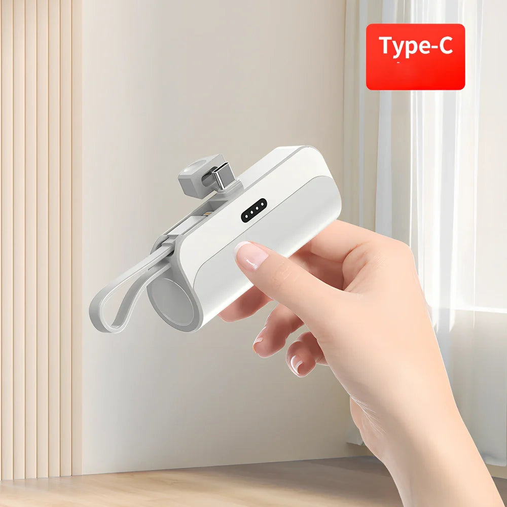 White capsule power bank showing compact 79mm size with USB charging ports visible