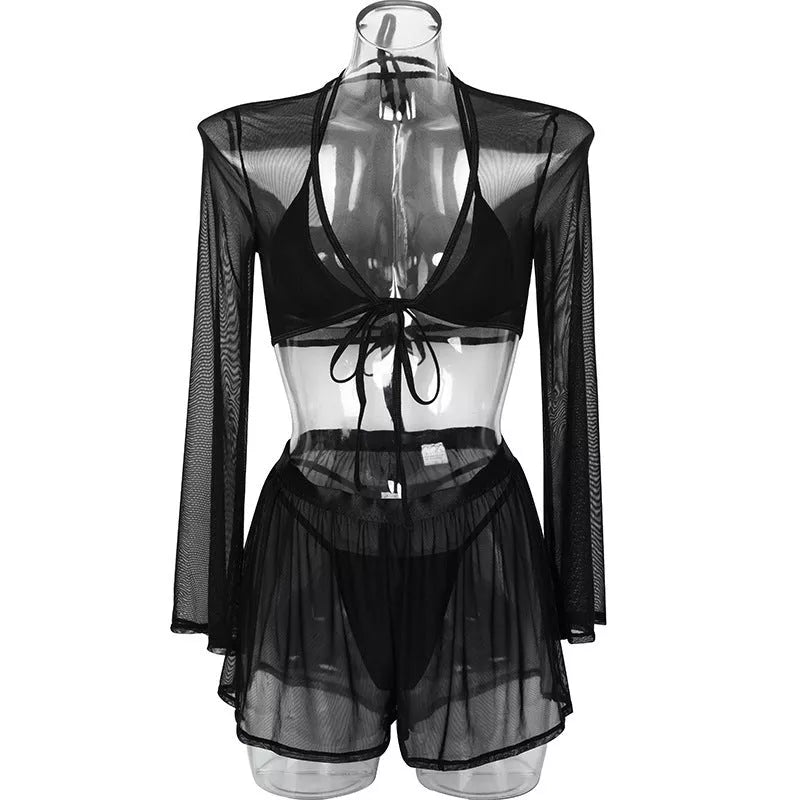 Solid black sling bikini set for women, includes bra, jacket, skirt, and shorts