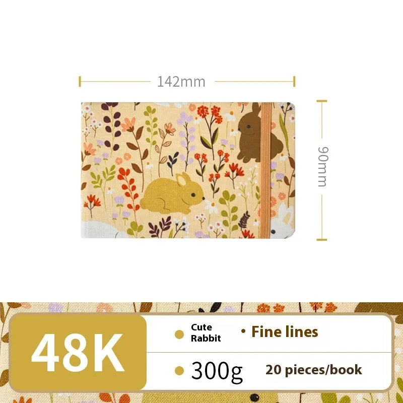 Feiluniao watercolour notebook with fabric cover, 185mm length, open to show paper for painting.