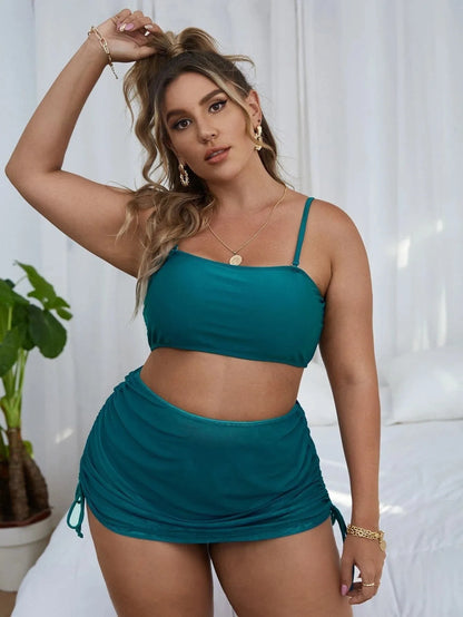 Women's solid colour mesh bikini three-piece set showing top, underwear and apron pieces