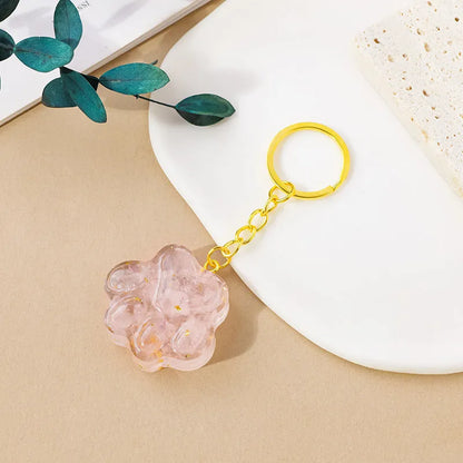 Natural crystal cat's paw keychain pendant showing gemstone options with integrated attachment loop