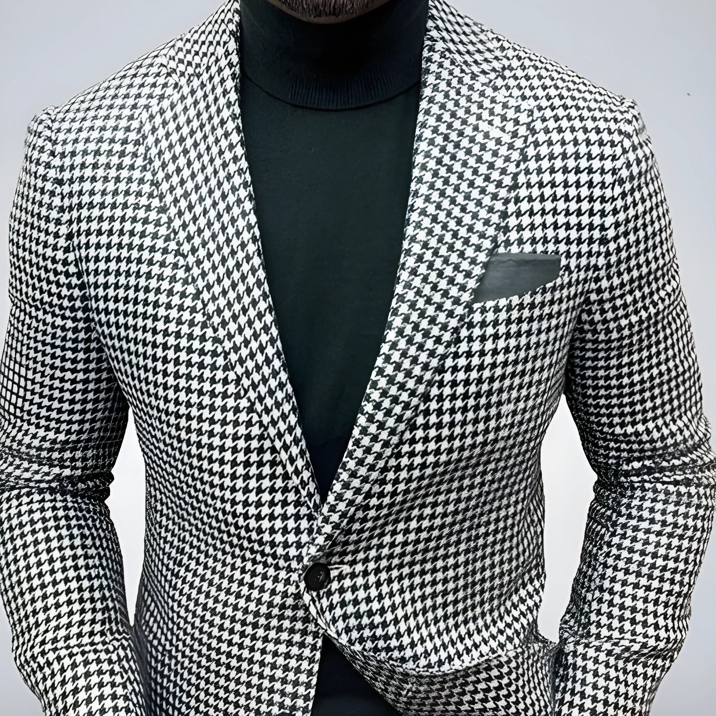 Men's slim fit two-button suit jacket with large top-stitch pockets in a polyester blend fabric.