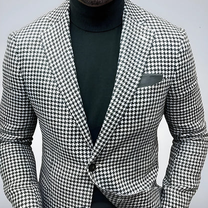 Men's slim fit two-button suit jacket with large top-stitch pockets in a polyester blend fabric.