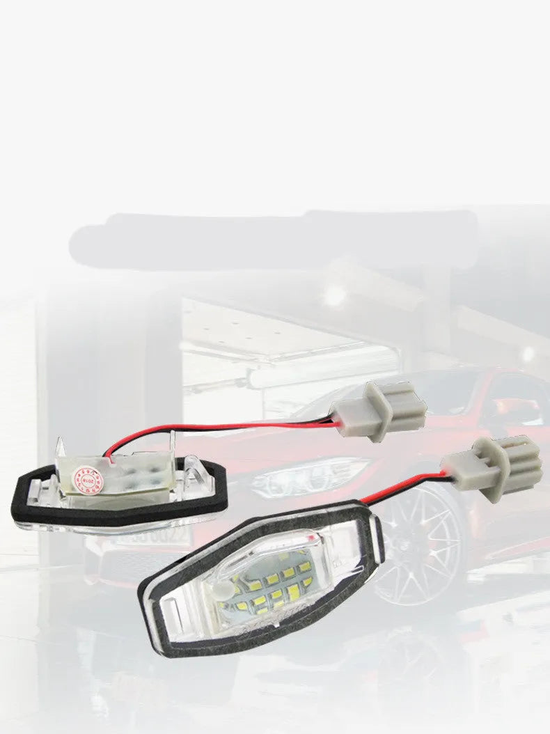 Honda Civic LED licence plate light showing white 6500-7000K illumination with plastic housing