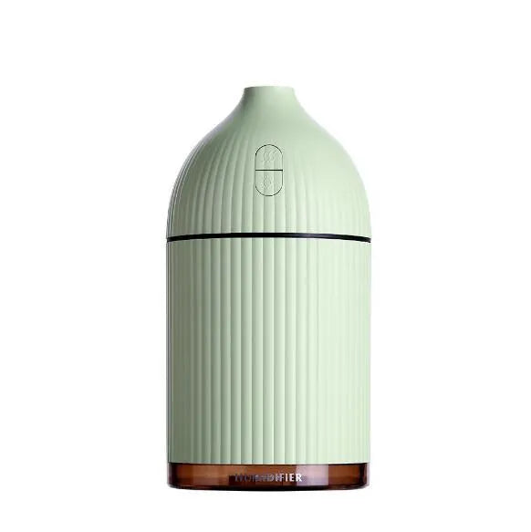 White USB-powered ultrasonic aromatherapy diffuser and humidifier with 300ml bottle and LED light on a desk.