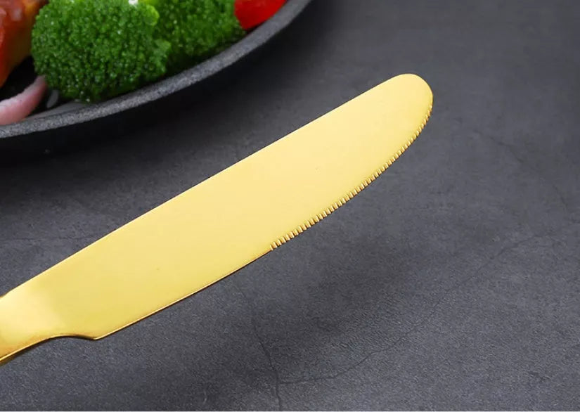 Stainless steel 24-piece tableware set with knives, forks, and spoons in rose gold, black, and gold