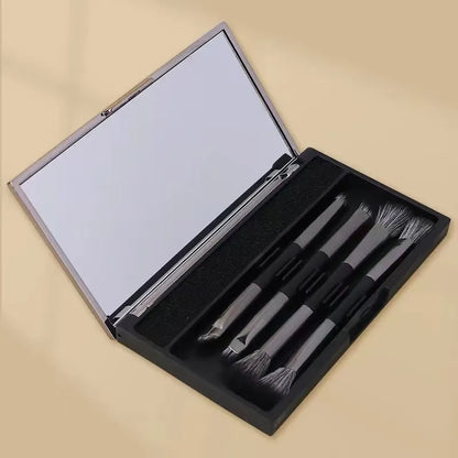 Makeup brush set with mirror compact case showing silver or gold brushes with artificial fibre bristles