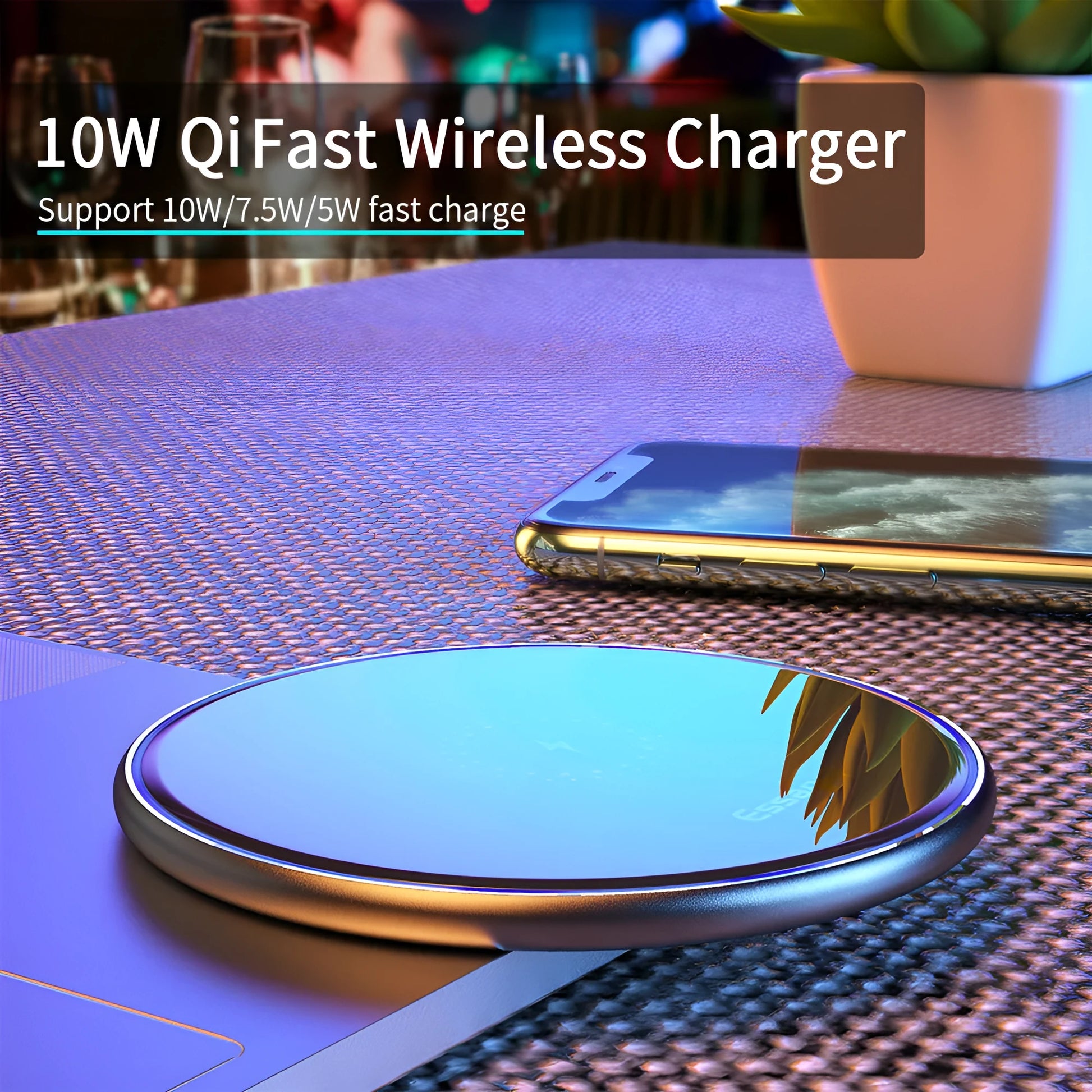 Black wireless charger on table with phone charging, showing blue LED light and anti-slip surface