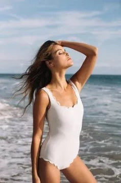 Black one-piece swimsuit with open back design, perfect for swimming and beach outings