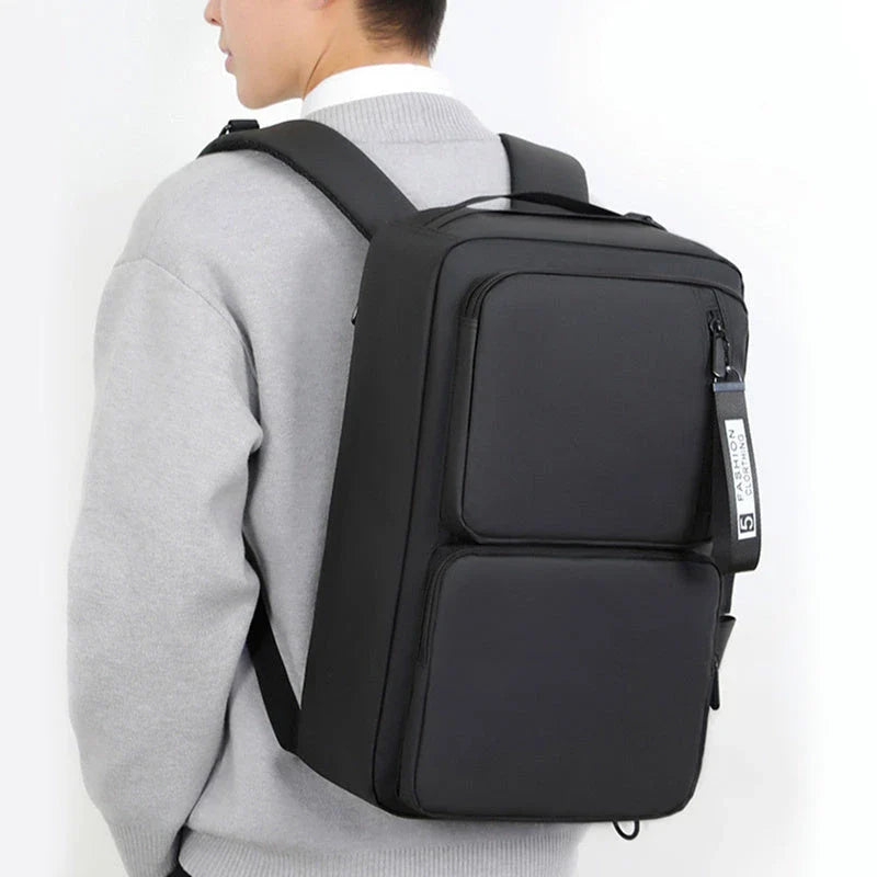 Versatile business laptop backpack with large capacity, USB charging port, and stylish design in gray and black colors