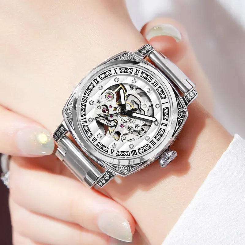 Mechanical watch with luminous hands on leather belt, stainless steel case, showing black colour option