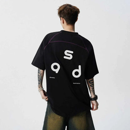 Black loose fit cotton T-shirt with white letter print on front, short sleeves and round neck.