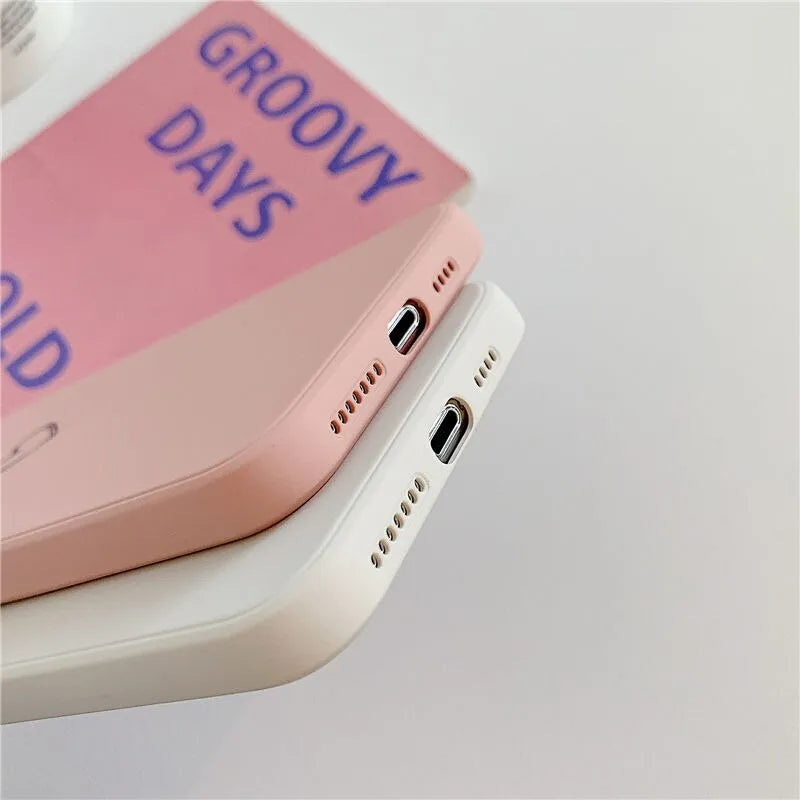 Silicone iPhone case in solid colours like black, green, pink, and white, showing TPU material and slim back cover design