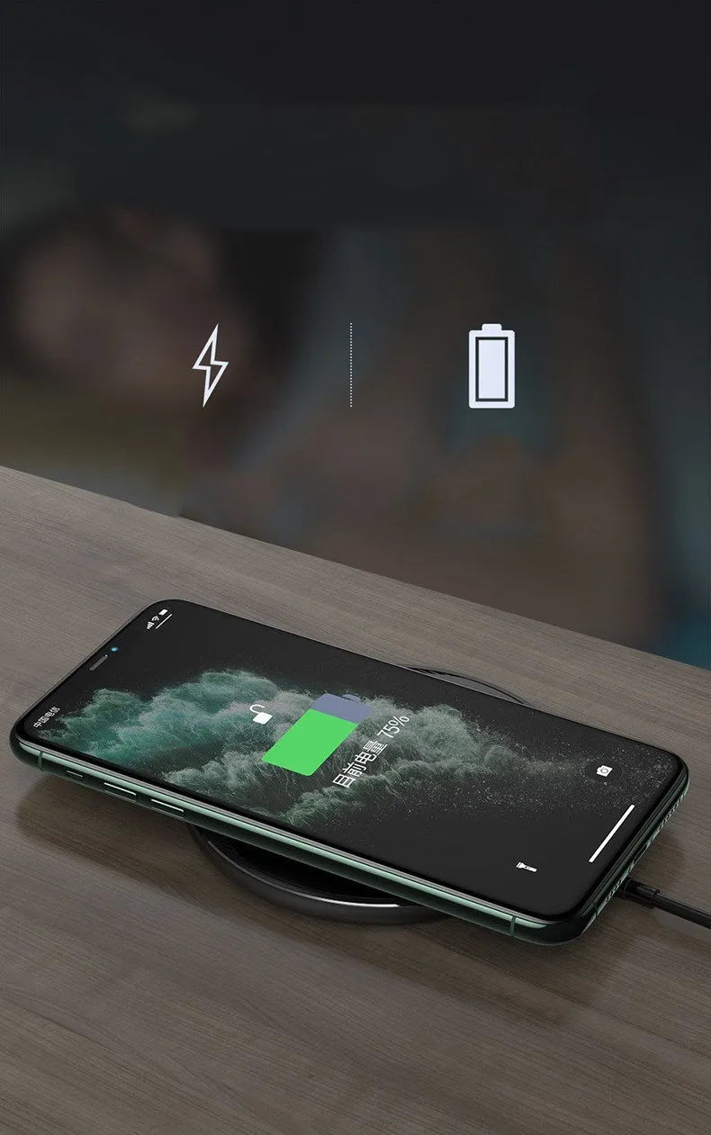 Black Kuulaa KL-CD16 wireless disc charger for mobile phones on a surface.