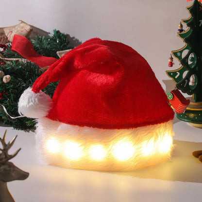 Red and white plush Santa hat with LED lights around brim in Christmas setting