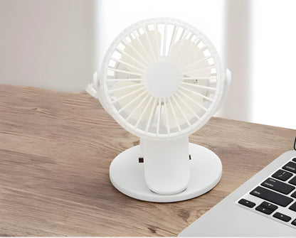 White USB rechargeable clip fan with plastic blades attached to a stroller handle.