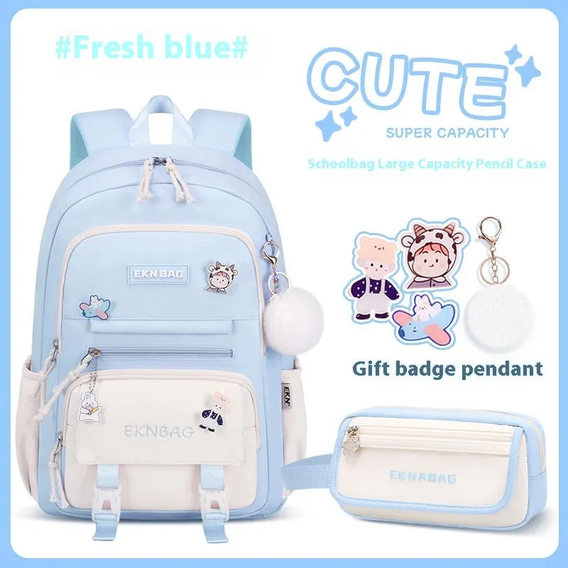 Pink waterproof Oxford cloth school backpack for girls with curved shoulder straps, shown with matching pencil case.