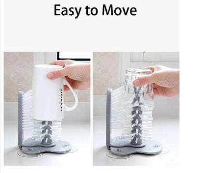 Grey rotating double-head cup brush with suction cups for wall mounting.