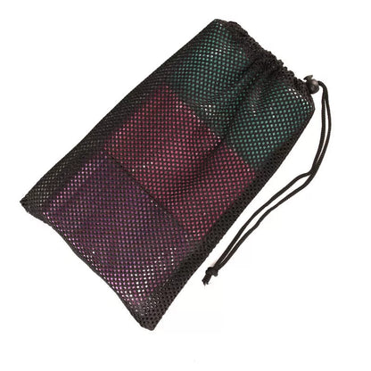 Squat resistance band hip ring in pink, purple, and green for lower body workouts