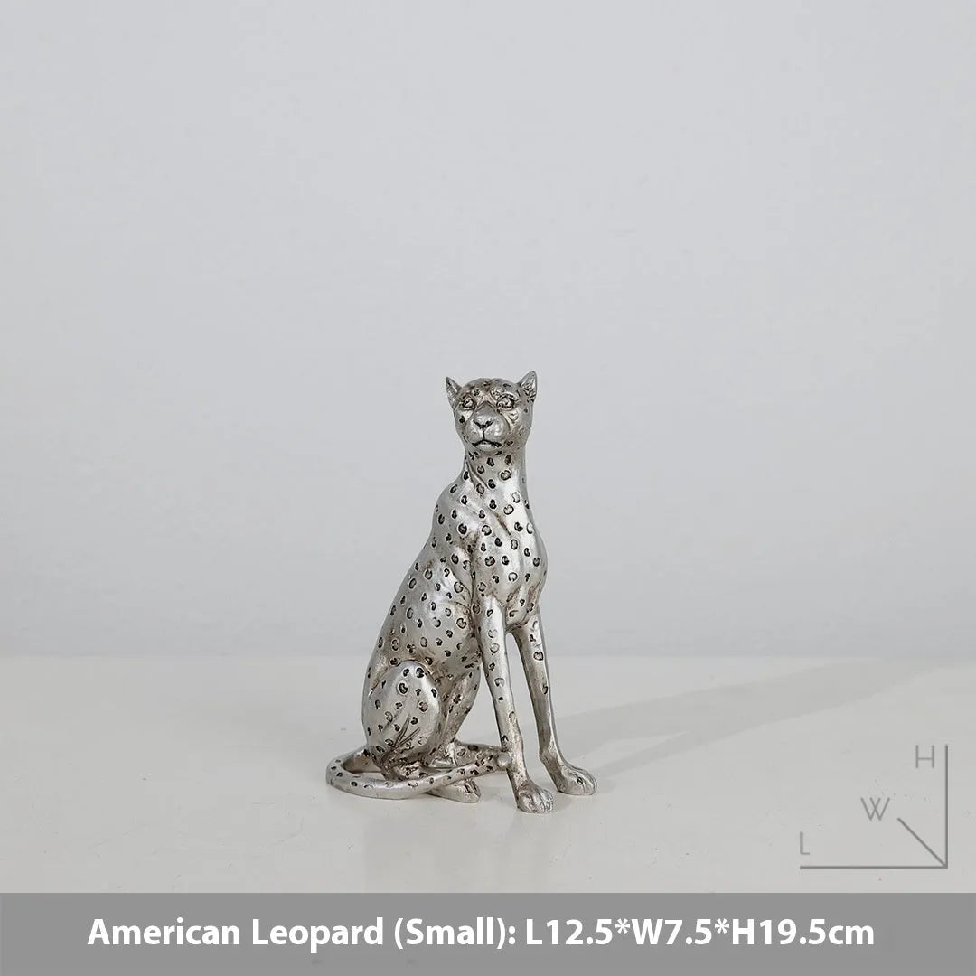 Leopard resin home ornament in American Leopard colour showing three pose variations on wooden surface