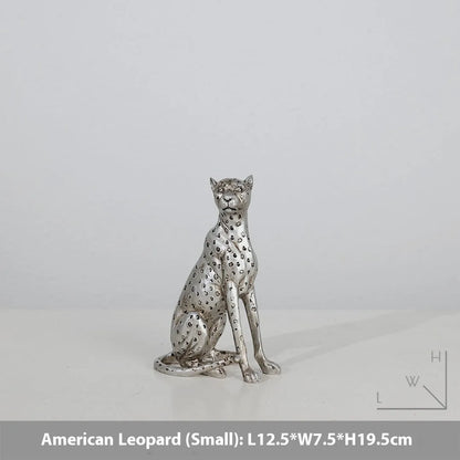 Leopard resin home ornament in American Leopard colour showing three pose variations on wooden surface