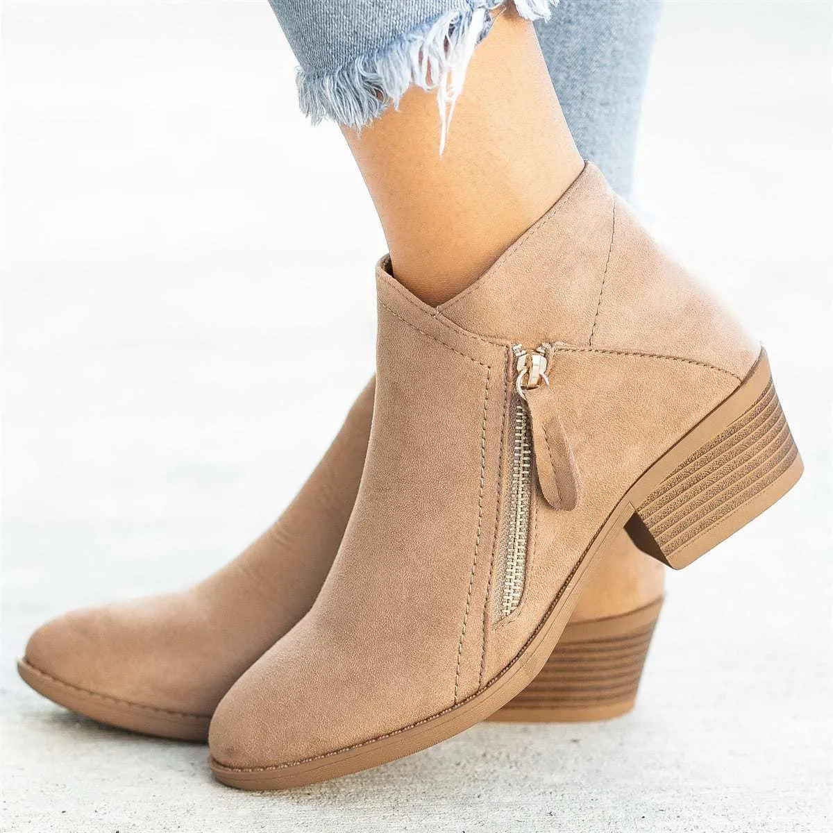 Women's blue suede Dr Martens ankle boots with side zip and chunky heel.