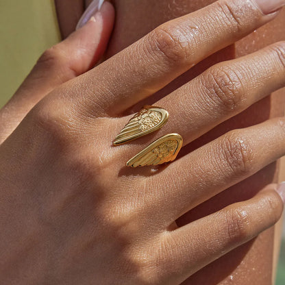 Stainless steel Wings fashion ring with an opening design on a white background.