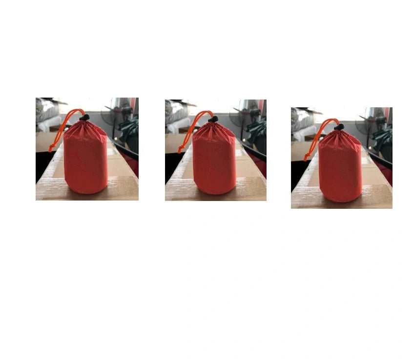 Orange First-aid Tent Insulation Mat reflecting sunlight, ready for emergency use